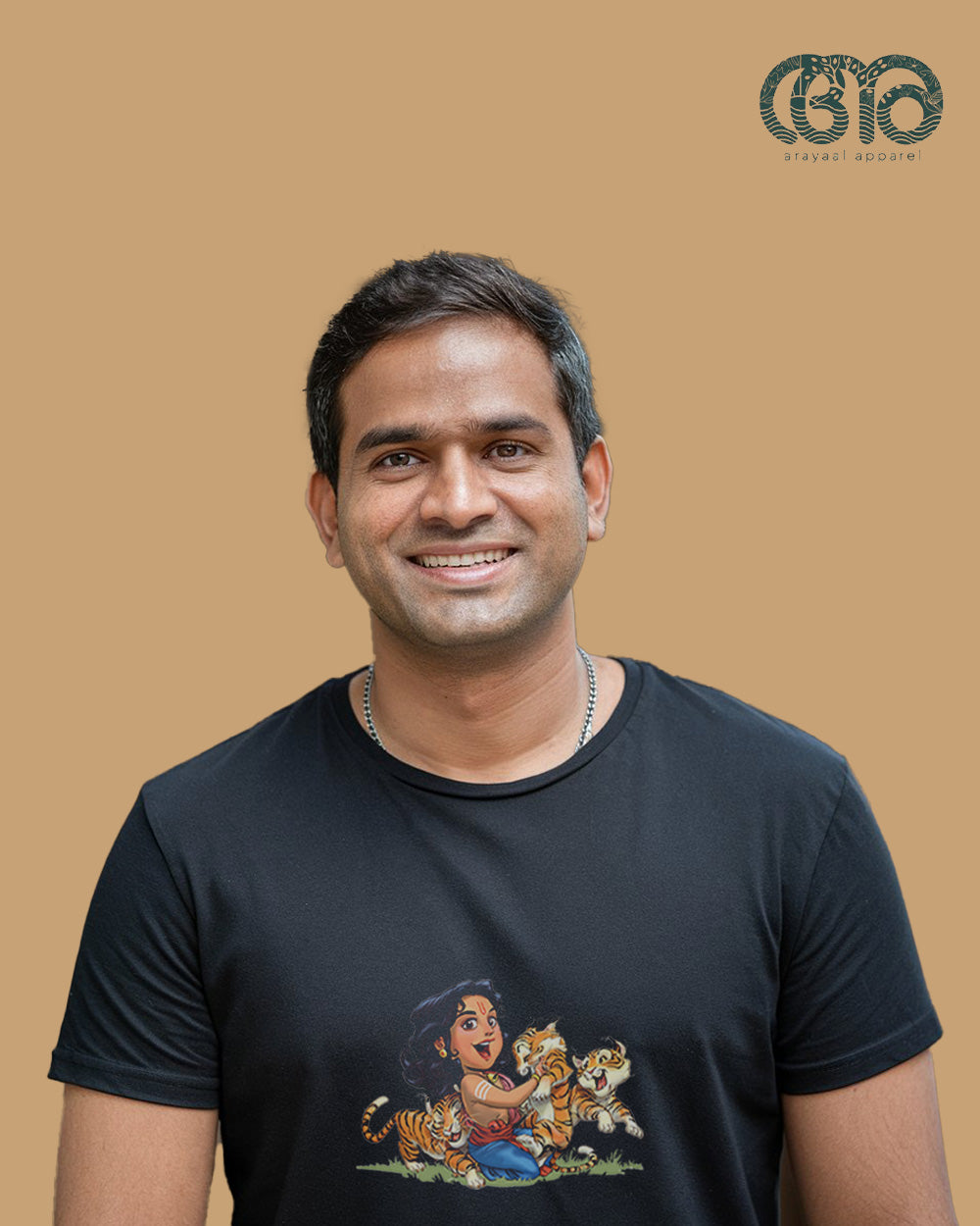 Black T-shirt with Sabarimala-themed design worn by a man with a neck chain